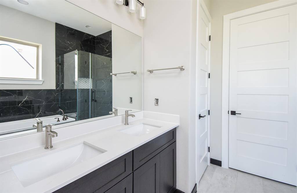 Primary Bath has Spa tub, large shower with floor to ceiling tiling!