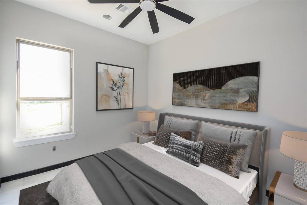 Bedroom 2 is spacious with ceiling fan. Virtually Staged Image