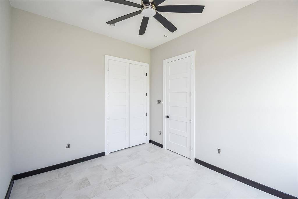 Bedrooms are spacious with ceiling fans.