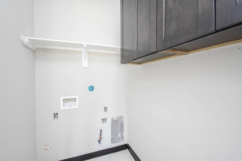 Utility Room w/Cabinets, Shelving and Gas/Electric for Dryer!