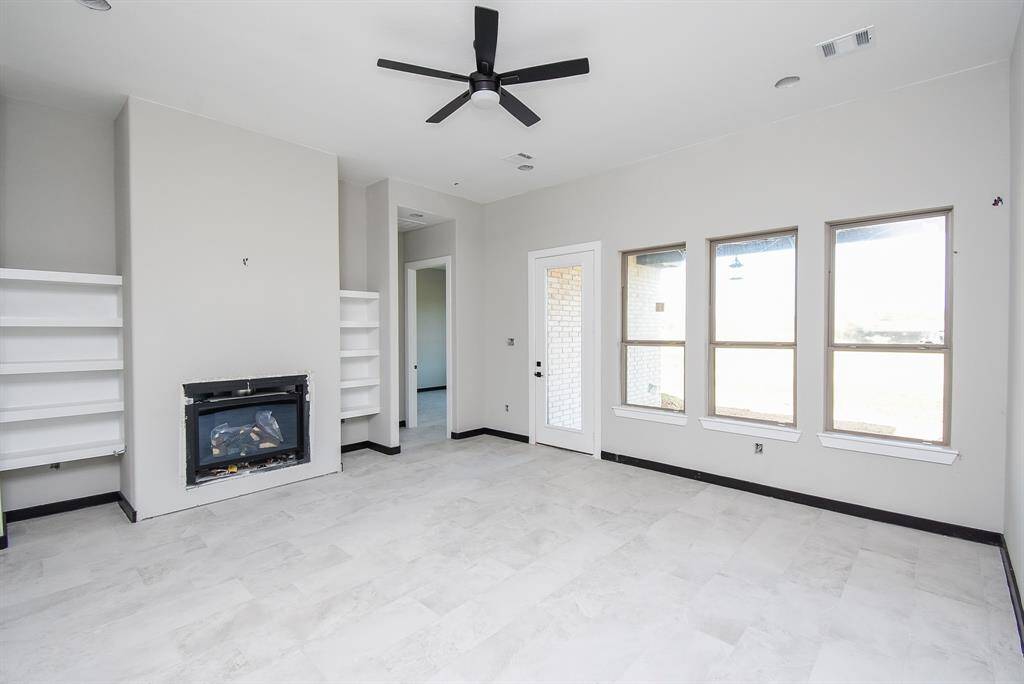 Family Room is huge with a fireplace and built-in shelves.