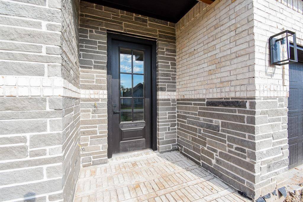 Stunning Entryway accented with attractive stone and brick design