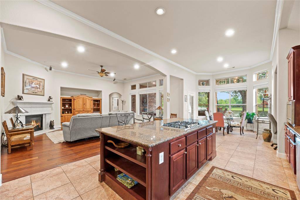 While whipping up your signature dish, the center island is sure to be packed with multiple taste-testers! You'll never miss what's going on in the living room while you're cooking - perfect for entertaining!