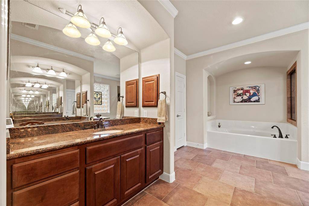 You don't have to share! Double sink vanities for each of you lends itself to harmonious mornings.