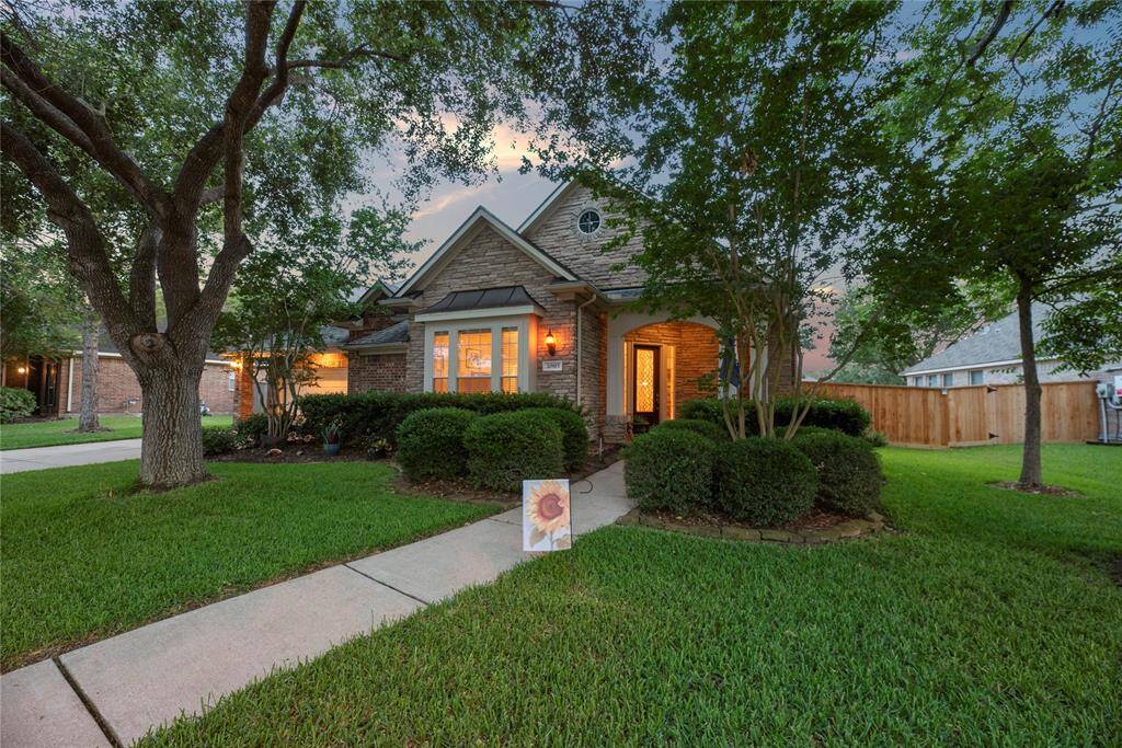 If you're looking for a home that stands out from the rest, you've found it! Begin your journey through the home with a beautiful entrance surrounded by an impressive landscape.
