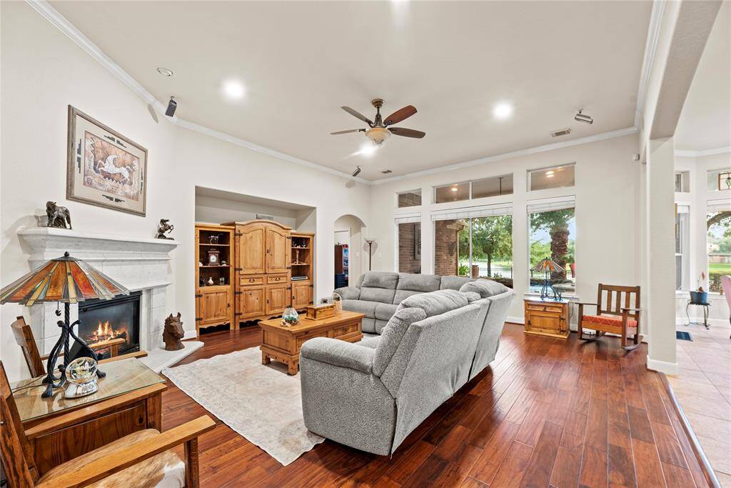 Welcome to the heart of the home, where comfort meets luxury. This family room boasts a grand wall of windows, allowing natural light to flow through the space.