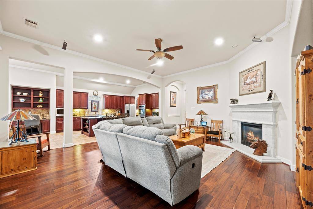 Featuring a cast stone mantle and gas log fireplace, this space exudes warmth and comfort. Settle your family into this spacious home and imagine evenings gathered in this comfortable living room.