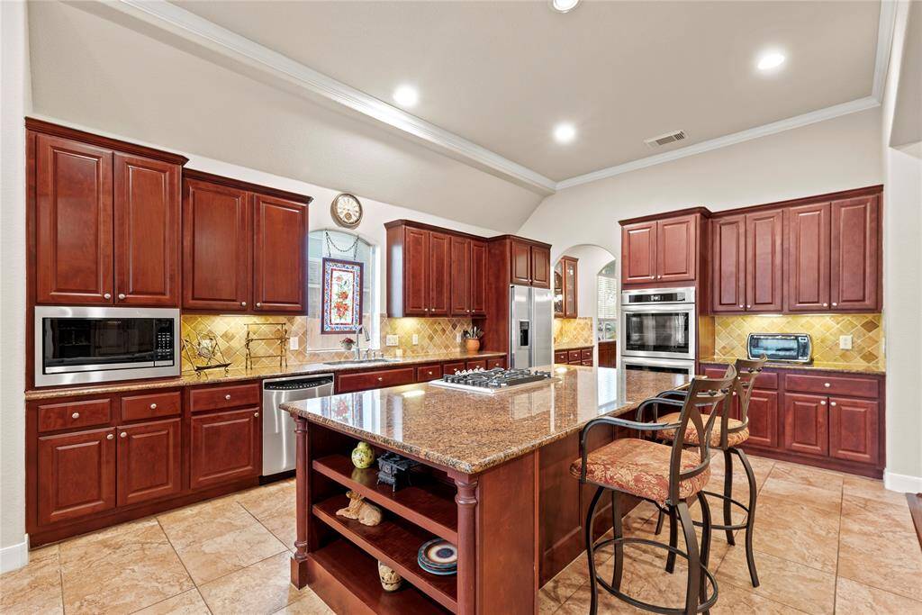This kitchen is sensational! Notice the amazing stainless steel appliances and accents, designed to add distinction and durability to your home's kitchen.