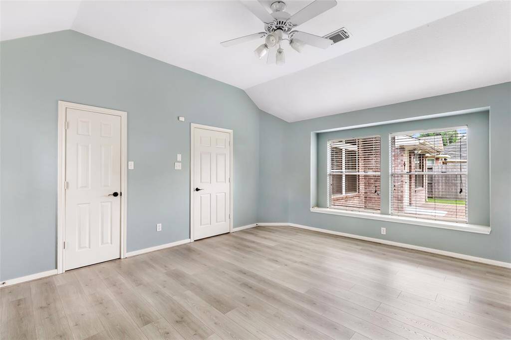 Primary Bedroom is updated with new flooring.