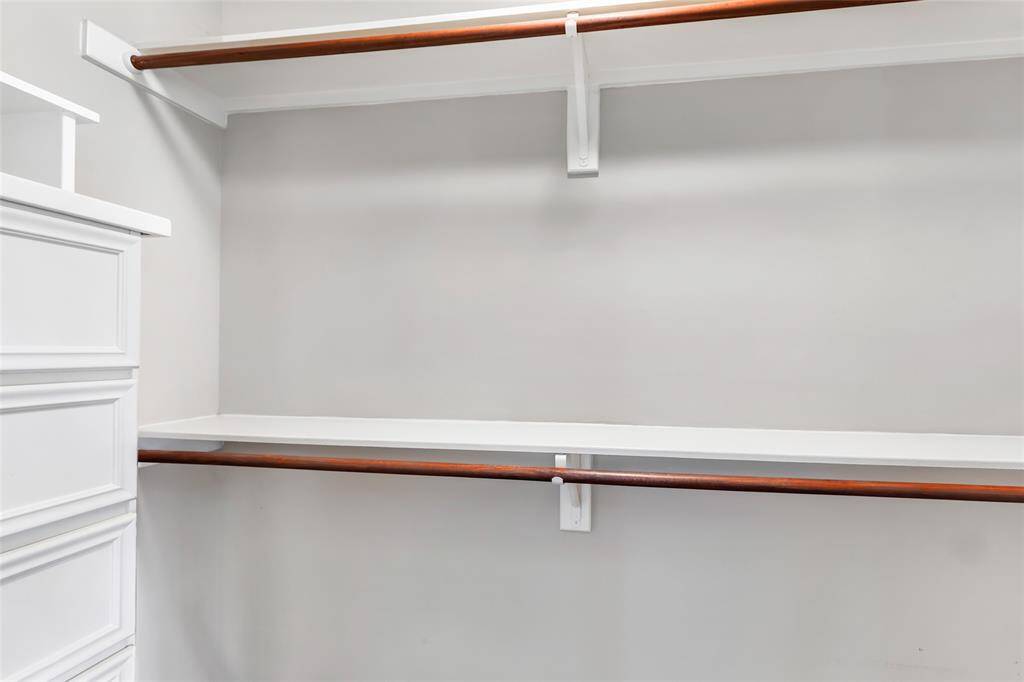One of two closets in the Primary Suite. This one has lovely built-in drawers.