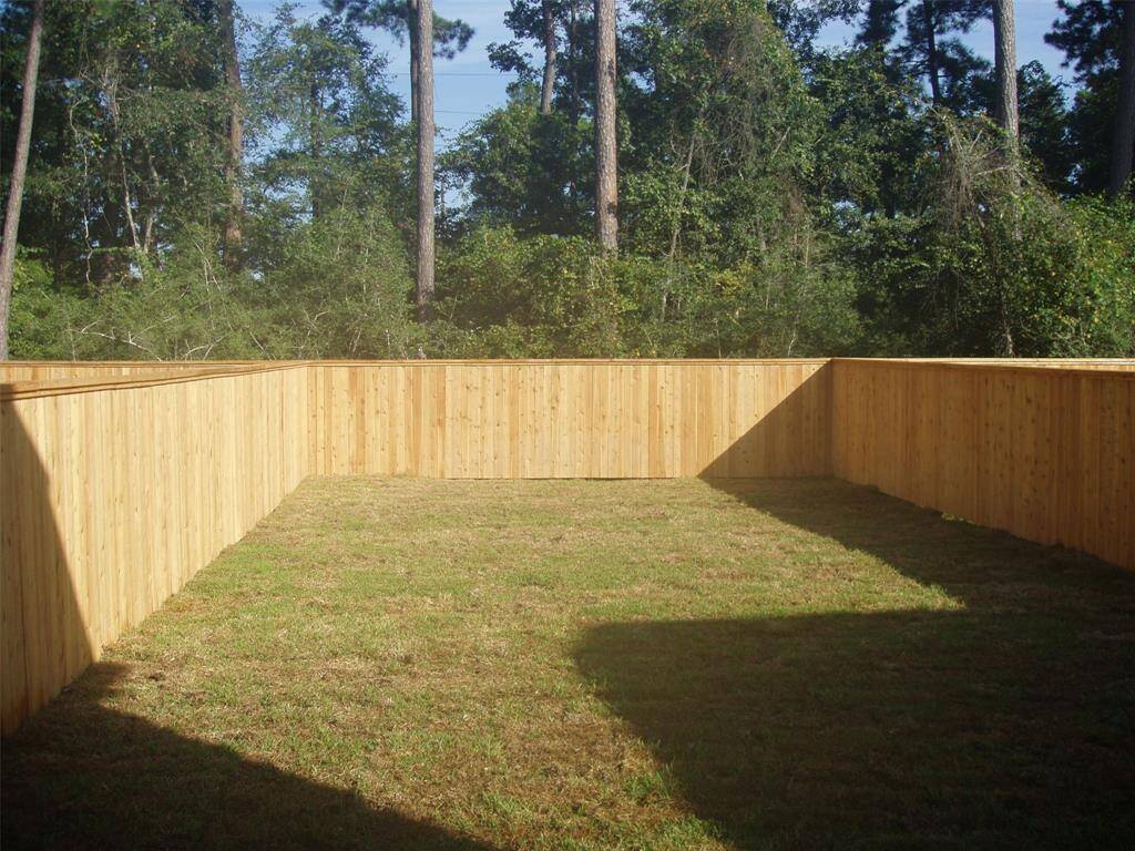 A large, fully fenced backyard.