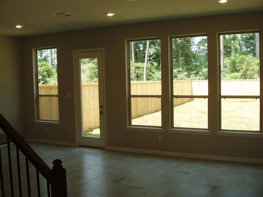 Open living area with a backyard view.