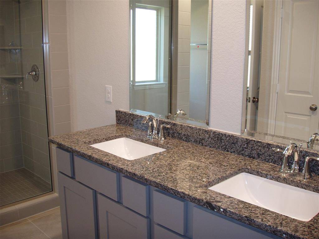 Granite counters in the master with double sinks.