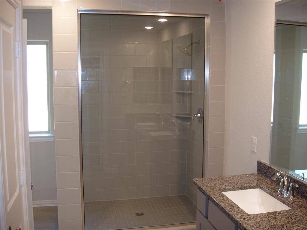 Massive walk-in shower located in the master bathroom