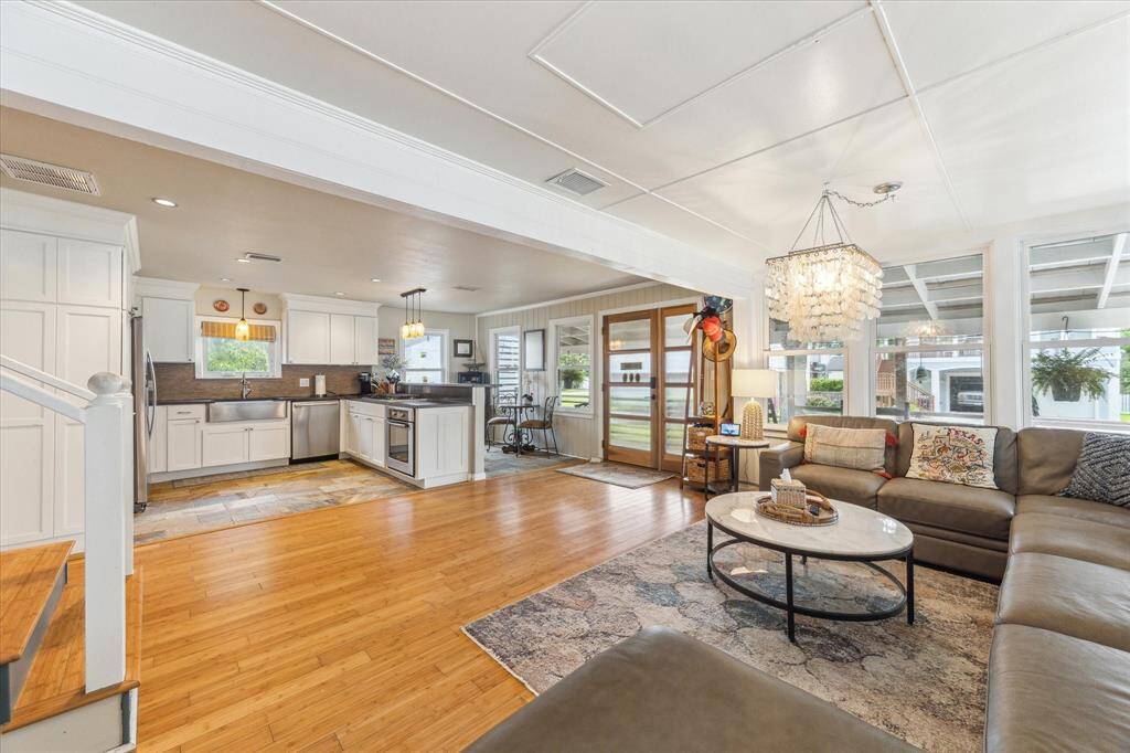 Spacious kitchen with breakfast bar and small eating area.