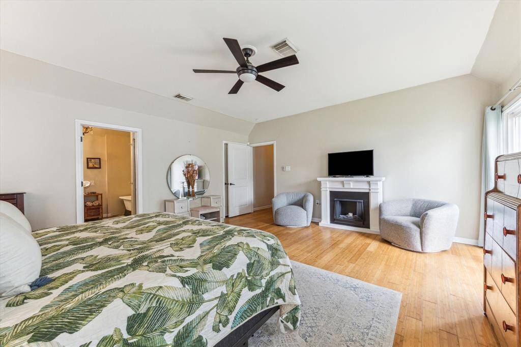 Primary suite has a sliding glass doors to backyard.