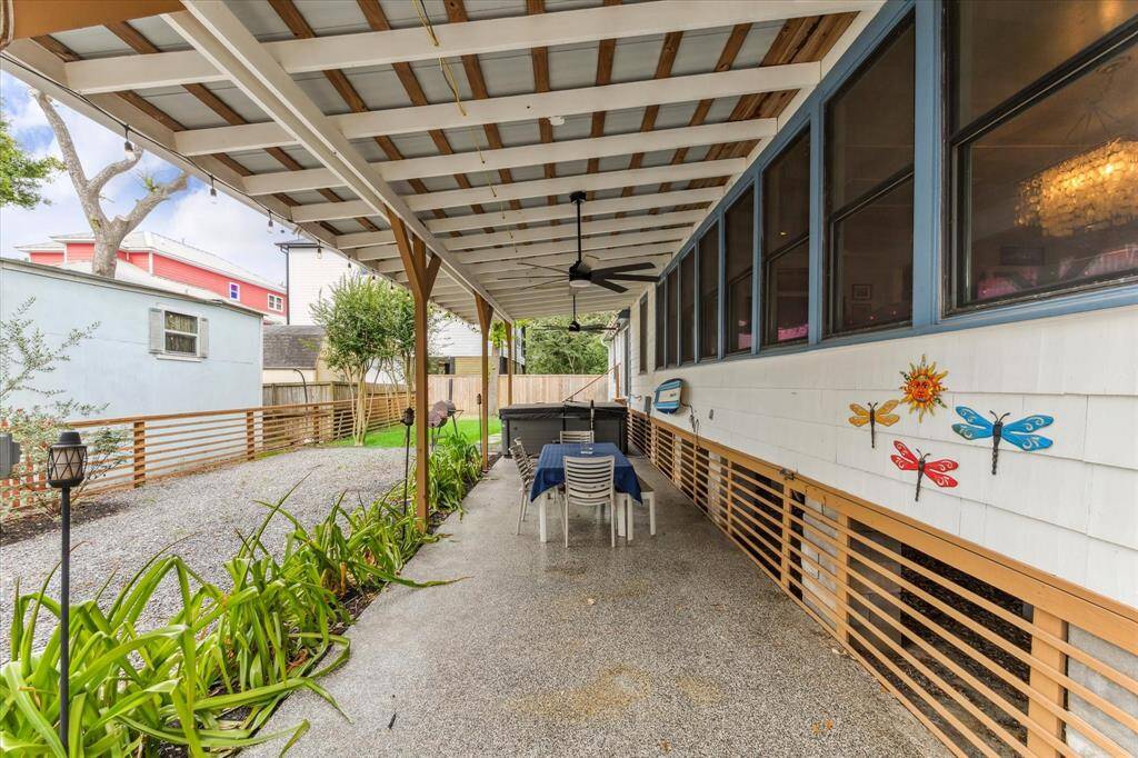 Covered space on the side can be used for parking, entertaining or just hanging out.