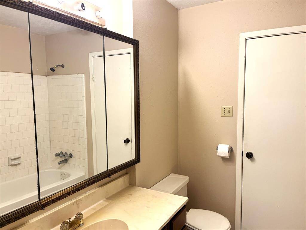 Here's the full bathroom, which can be accessed from the primary bedroom or the hallway...