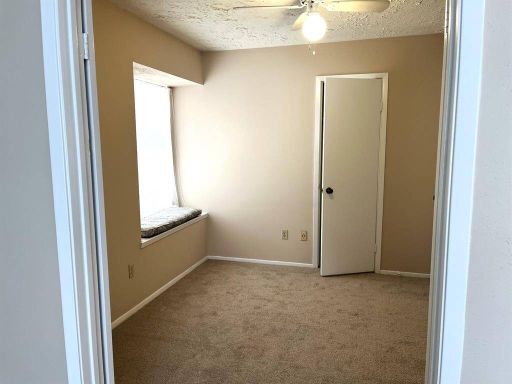 A set of double doors leads to the first bedroom - this room would make a great home office!