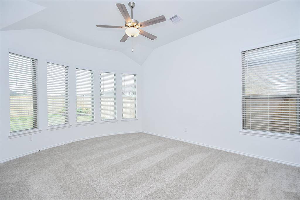 Gentle bay windows line your exquisite carpeted primary suite!