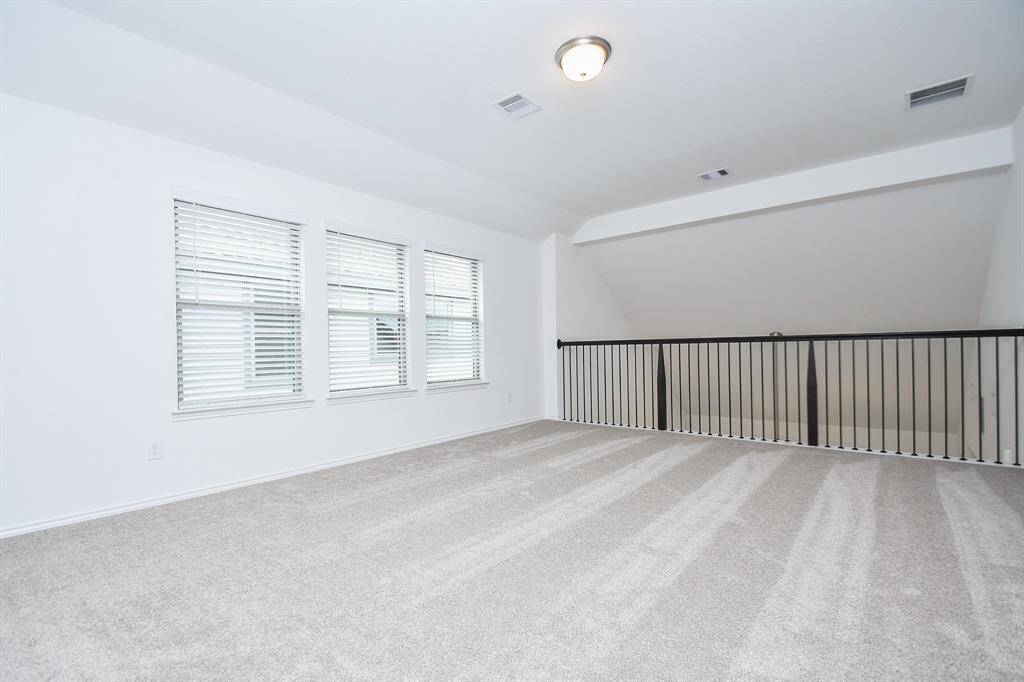 Here we are on the 2nd 'game room' floor, proper, with a beautiful view of and access to the upstairs wrought iron railing.