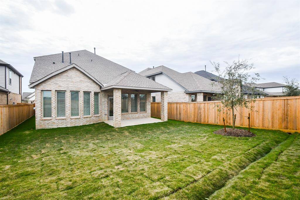 What a pleasing, idyllic sight! Your spacious covered patio is a sure outdoor retreat in seasonal weather.