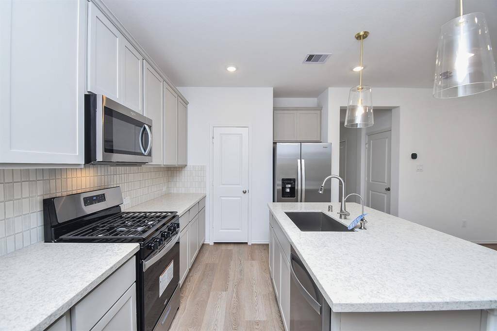 It's clear sailing, even when eager helpers offer their services in this one-of-a-kind kitchen!
