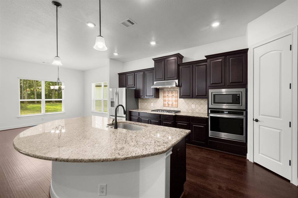 looking into the kitchen and dining area