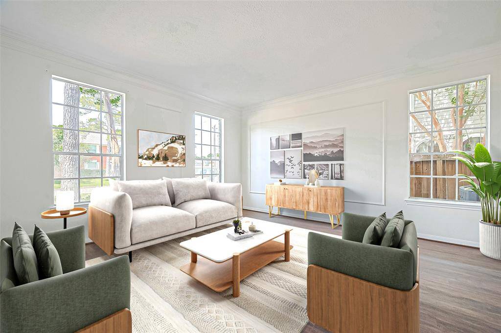 Virtual Staging: Expansive Living room featuring double crown molding, picture frame molding