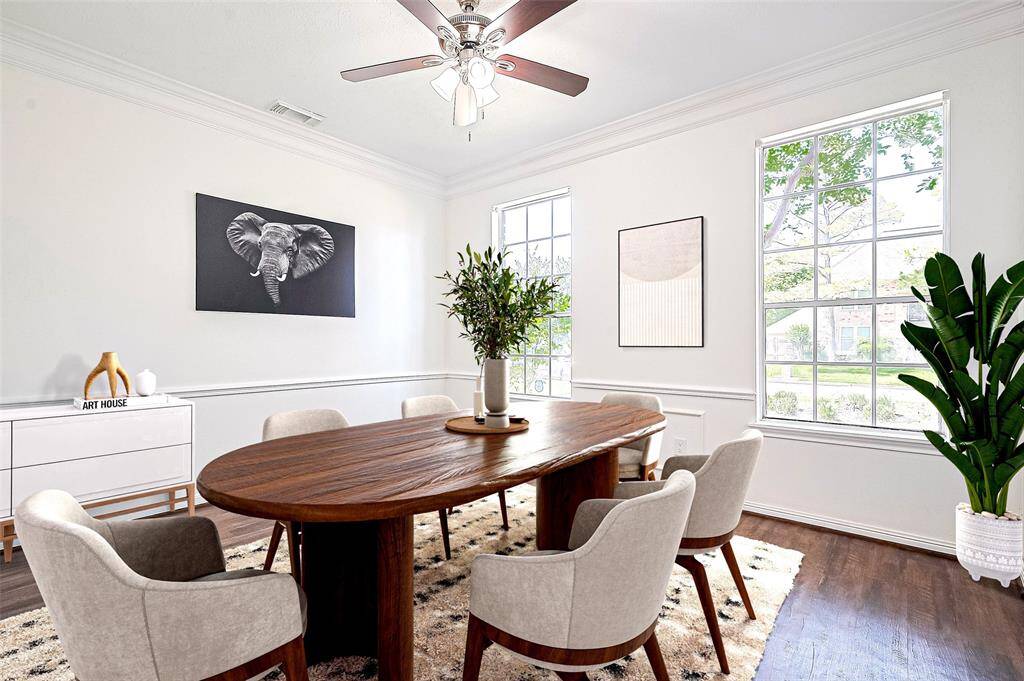 Virtual Staging: Another view of dining room from Kitchen with tall windows and plenty of natural light