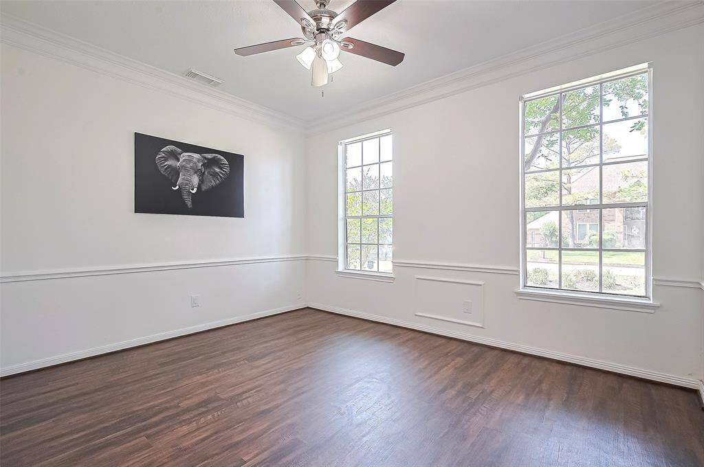 Another view of dining room from Kitchen with tall windows and plenty of natural light