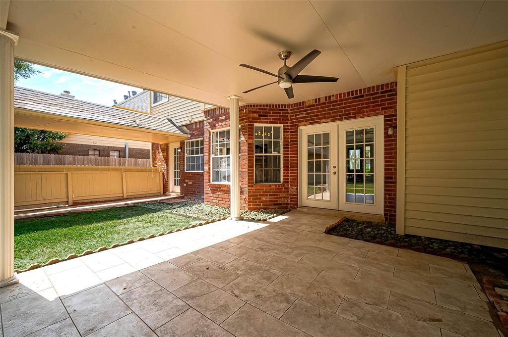 Enjoy year-round outdoor gatherings on this spacious covered patio—perfect for grilling, dining, and entertaining in any weather