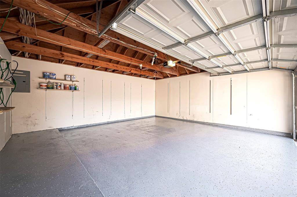 Spacious two-car garage with ample room for parking, storage