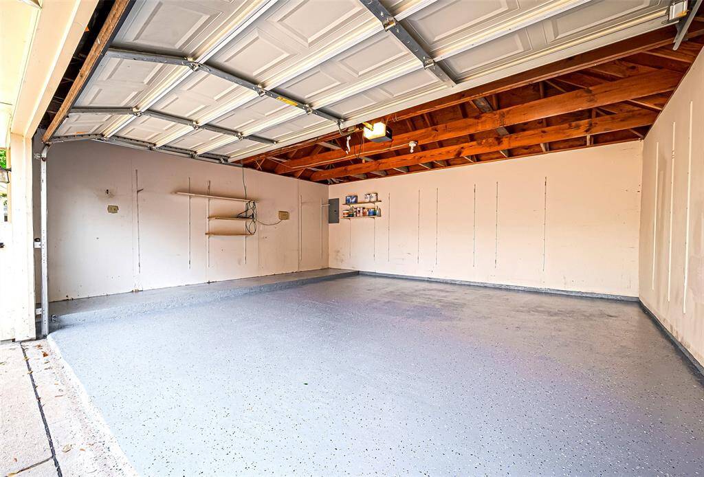 Freshly applied epoxy flooring in the garage adds a sleek, durable finish—resistant to stains and easy to maintain