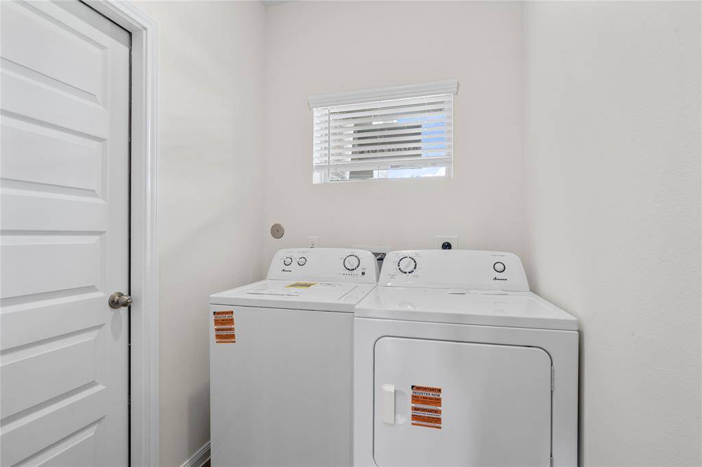 Utility Room featured here comes with a washer and dryer set and is located on the first floor .