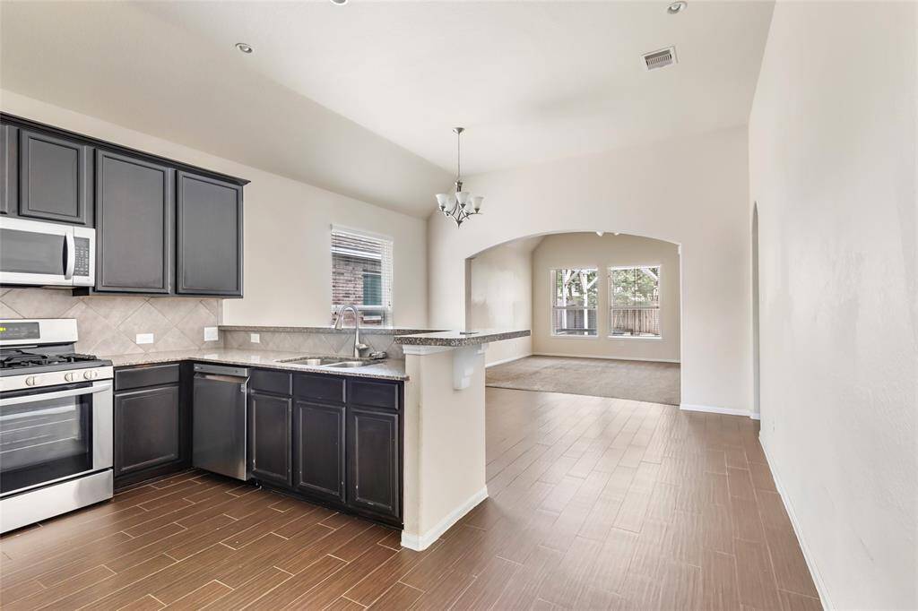 Looking into the open concept home from front entry hallway