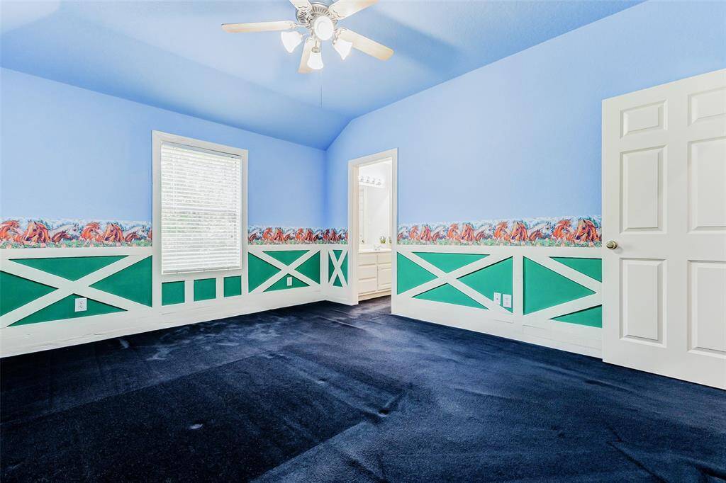 One of the secondary bedrooms on the 2nd floor features a unique lower wall design and colorful border to mimic a horse paddock. Perfect for any horse enthusiast!  Easy access to the adjoining bathroom.