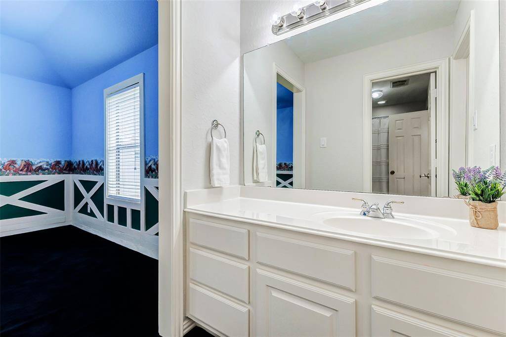 The vanity area adjacent to the secondary bedroom.