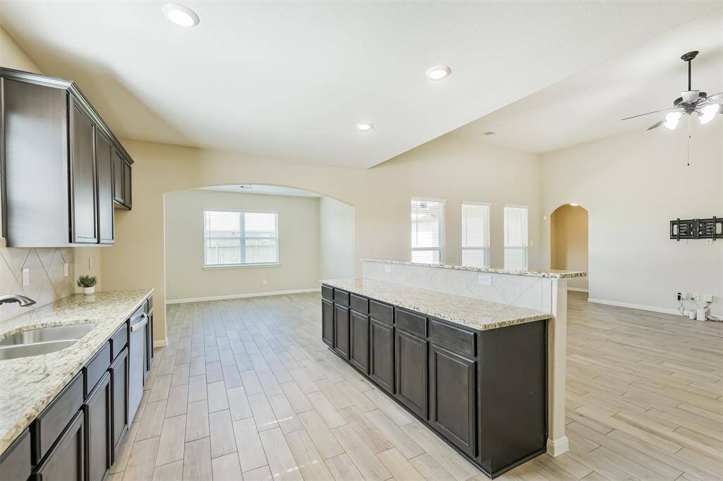 Kitchen is open to living room and dining room with lots of natural light.