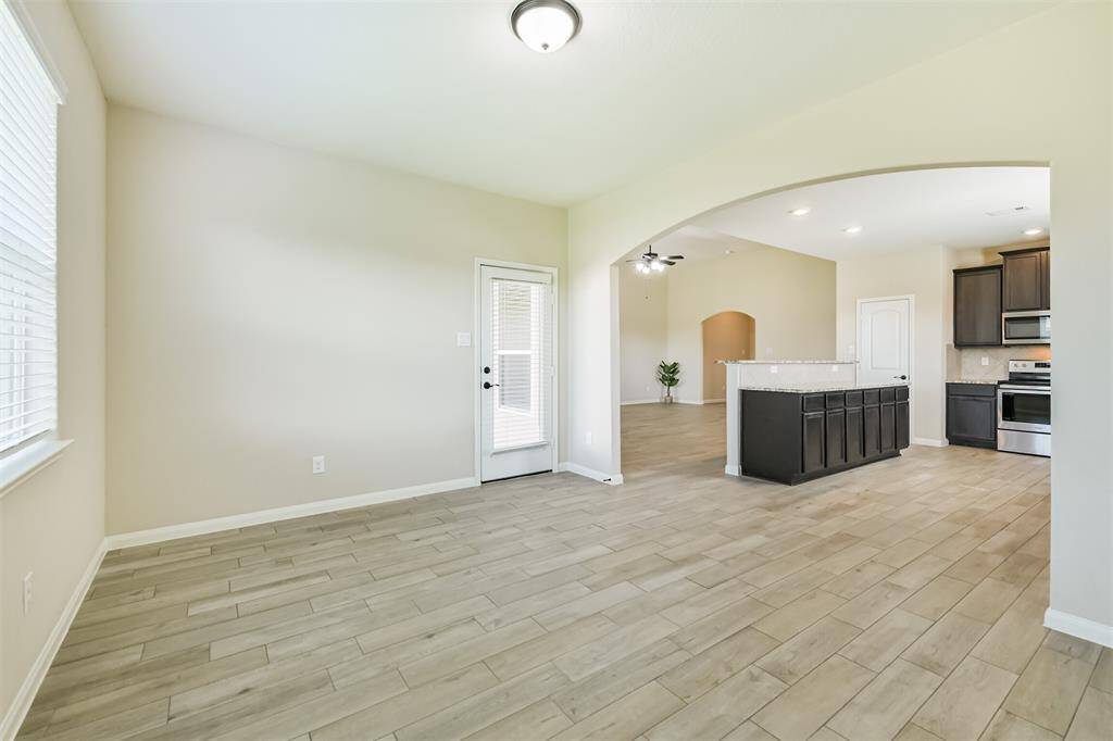 Arched entry to the dining room provides an upgraded look.