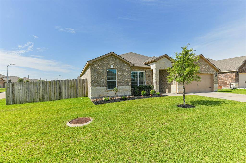 This home has a large corner yard with even more space on the side.