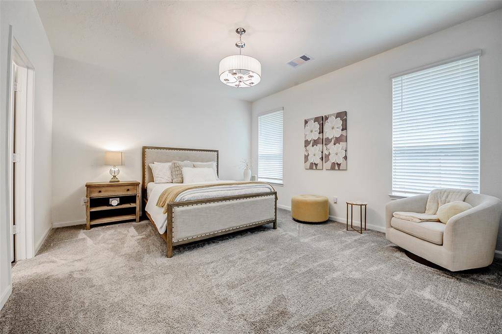 Wake up every morning in your light-filled primary bedroom with peaceful views of the backyard, where towering trees—not neighbors—are all you’ll see.
