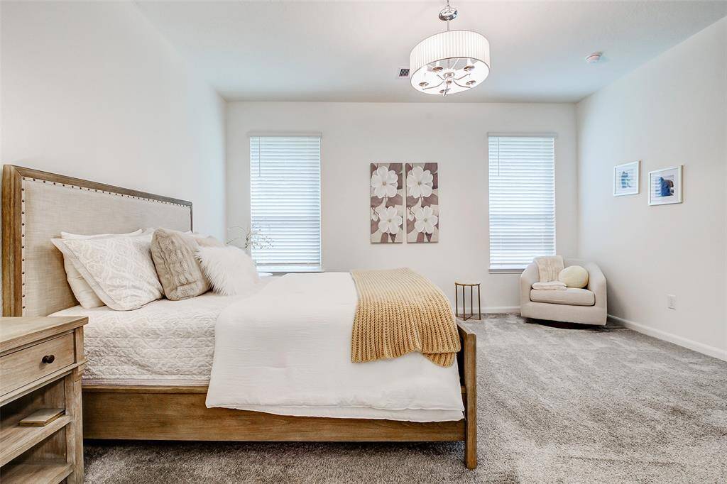 Start and end your day in a light and airy primary suite that looks out onto a serene, tree-lined backyard