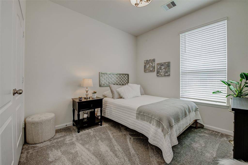 Secondary bedroom being used as a guest room, and has a large closet.  This room is located to the left of the secondary bathroom.