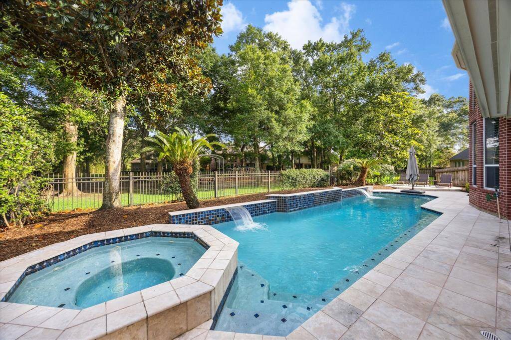 Prime Cinco Ranch Location in Sought-After Cinco Forest: This showstopping ‘Estate Collection’ home offers a rare blend of privacy, thoughtful design, and timeless upgrades—plus unmatched access to Cinco Ranch’s best amenities and schools.