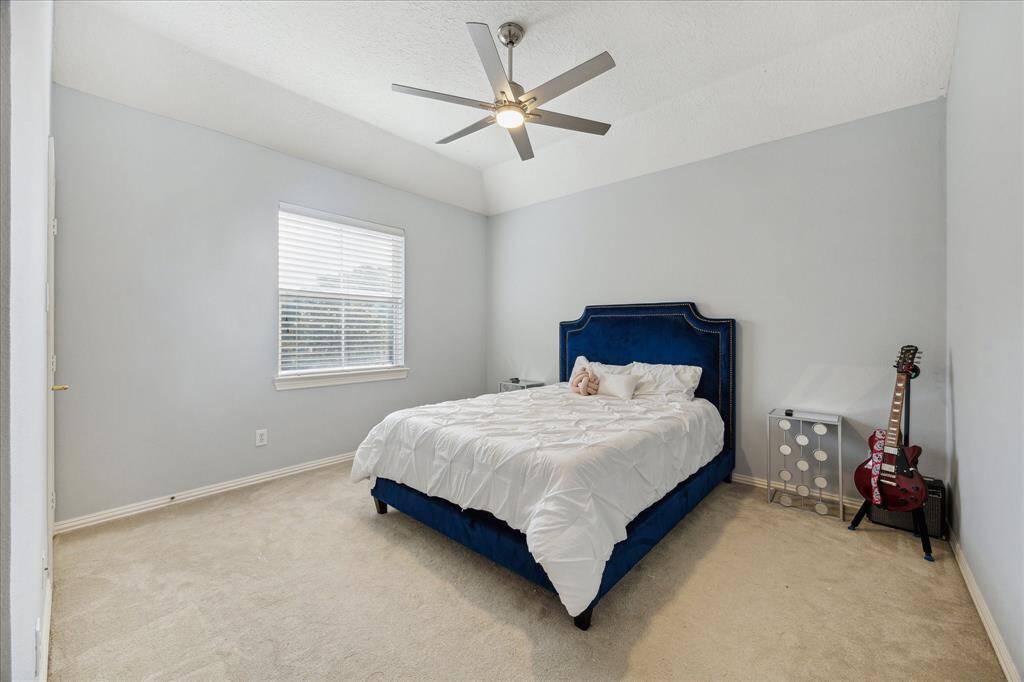 Private Ensuite with Timeless Touches: This upstairs bedroom offers its own fully updated bathroom with fresh finishes and a clean, classic design.