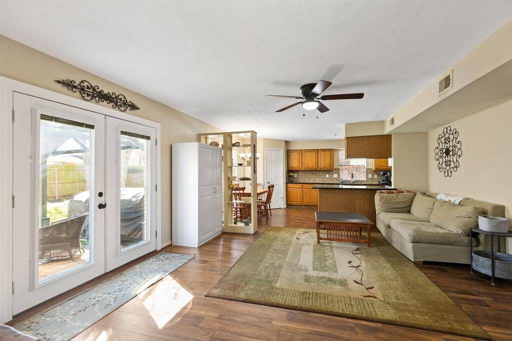 Another view of family room. This room is perfectly situated to allow you to stay connected with the kitchen, offering an open view of the activity, making it easy to engage with family or guests while preparing meals.