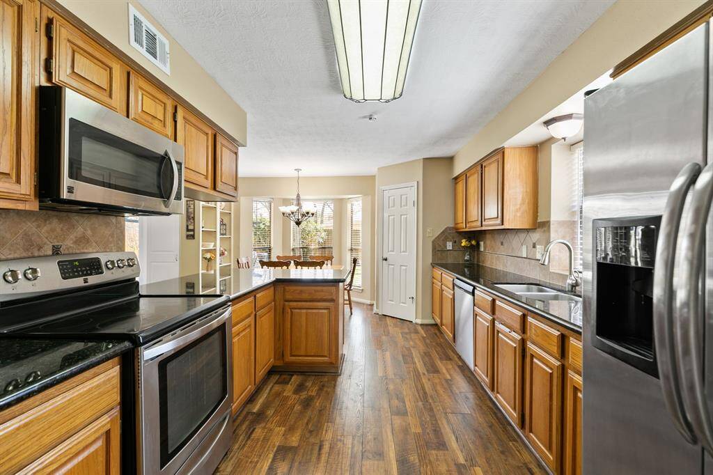 The kitchen is equipped with stainless steel appliances. The dishwasher was replaced in 2024, ensuring it’s in great condition for everyday use.