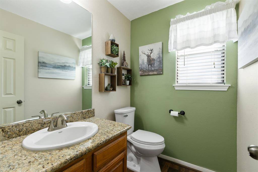 .The half bath is conveniently located near the family room and backyard, offering easy access for guests. All three toilets in the home were replaced in 2024.
