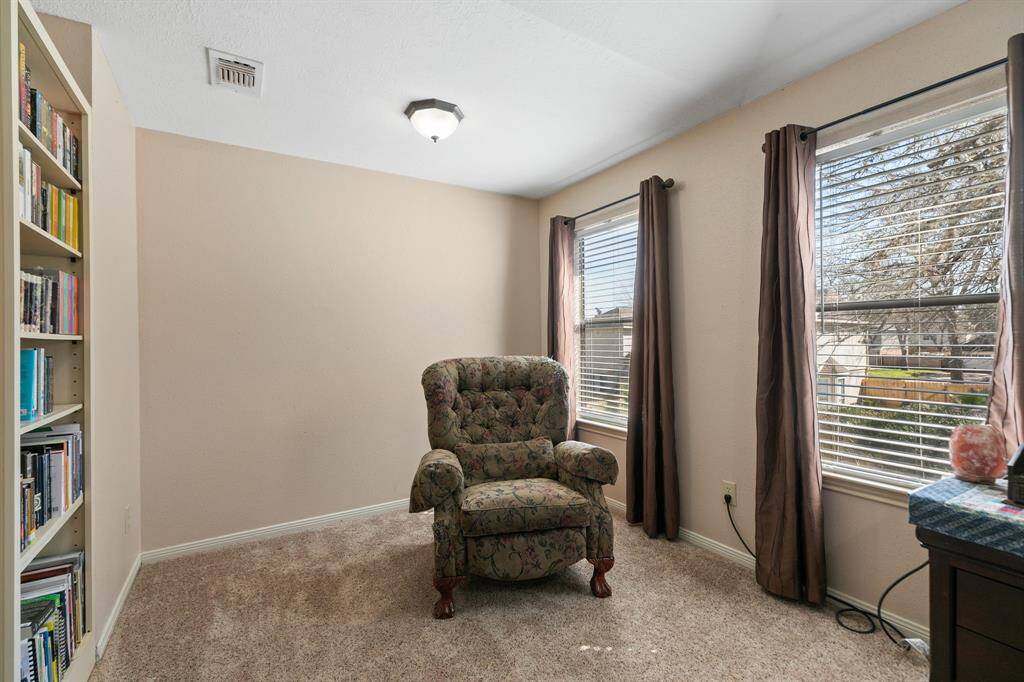 The primary bedroom features a cozy sitting area with a built-in bookshelf, making it a perfect spot for reading or you can place your exercise equipment here, so that you can work out at home!